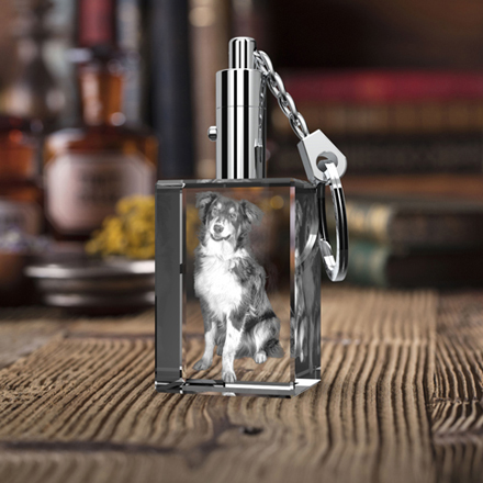 An adorable dog image engraved inside a 3D photo crystal keychain