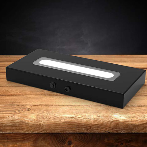 Wood LED light base with a dark background
