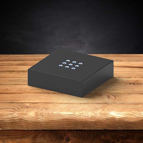 A plastic black light base for 3D photo crystals.