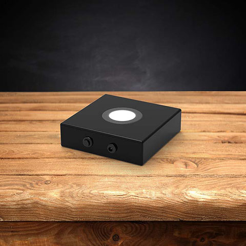 Wood LED light base with a dark background